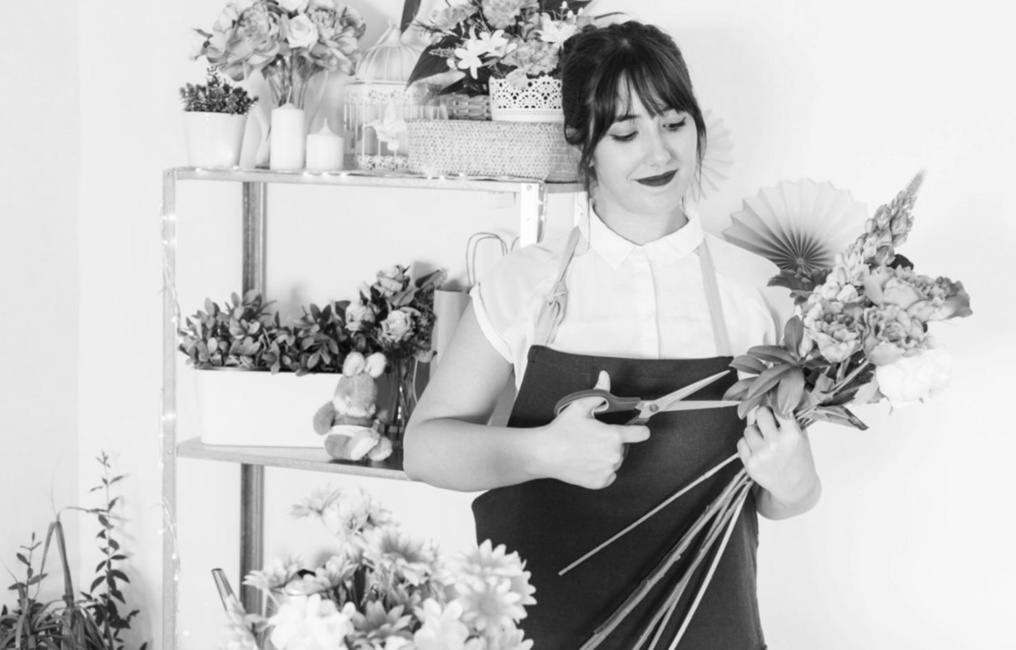 Group of floristry students working together on arrangements